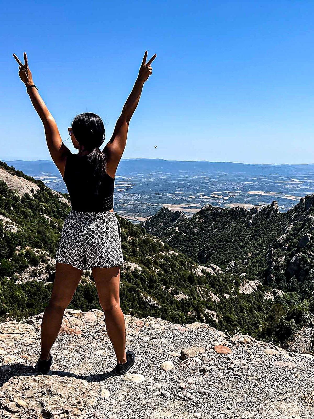Marie hiking among the mountain scenery at Montserrat.