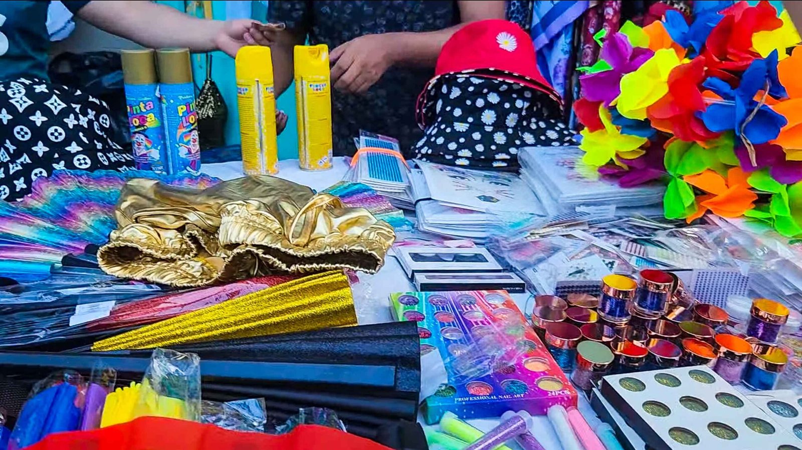 Glitter, colorful accessories and costume supplies at a Carnival street stall