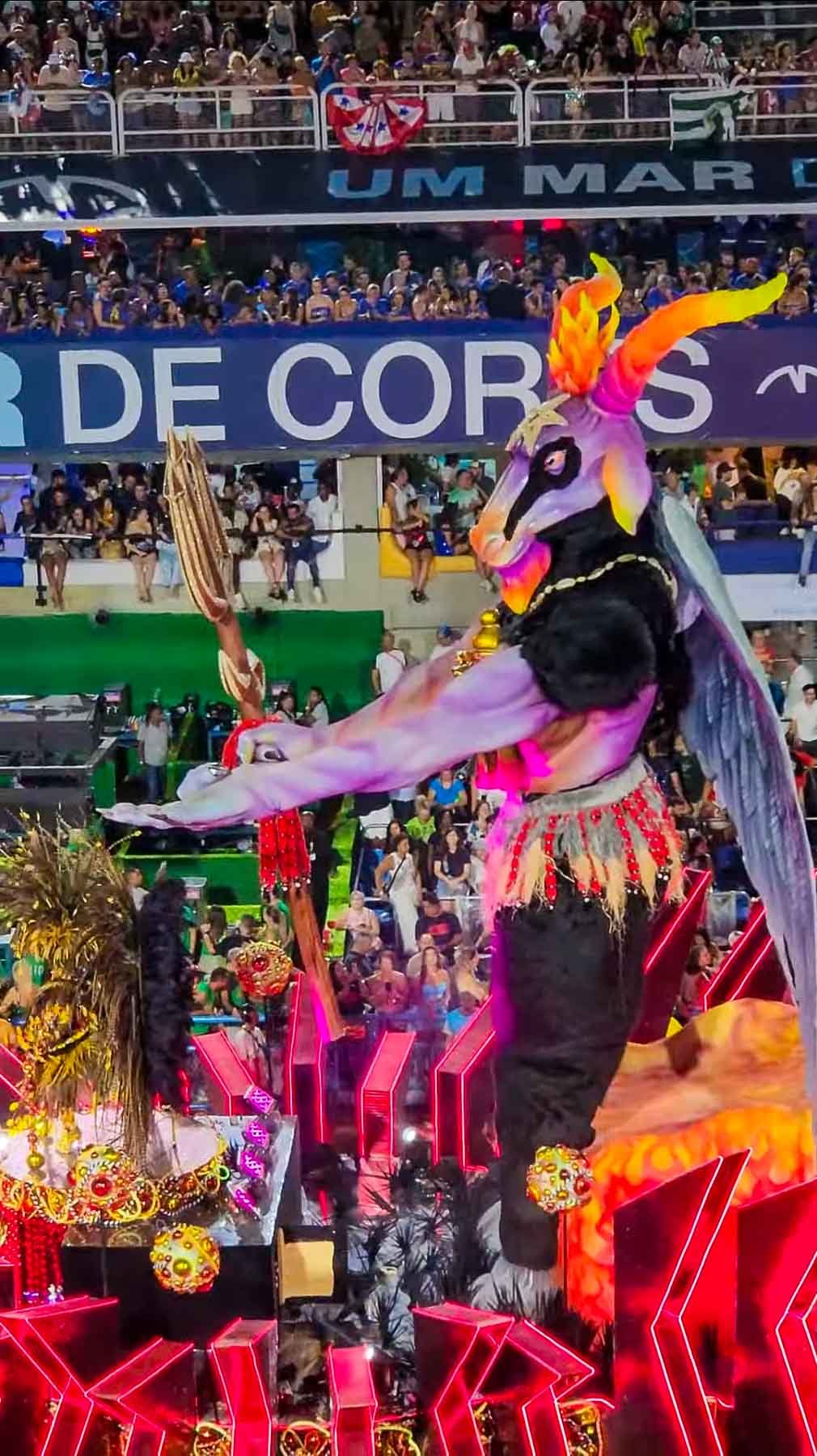 Giant colorful parrot on an illuminated Carnival float at Rio's Sambadrome