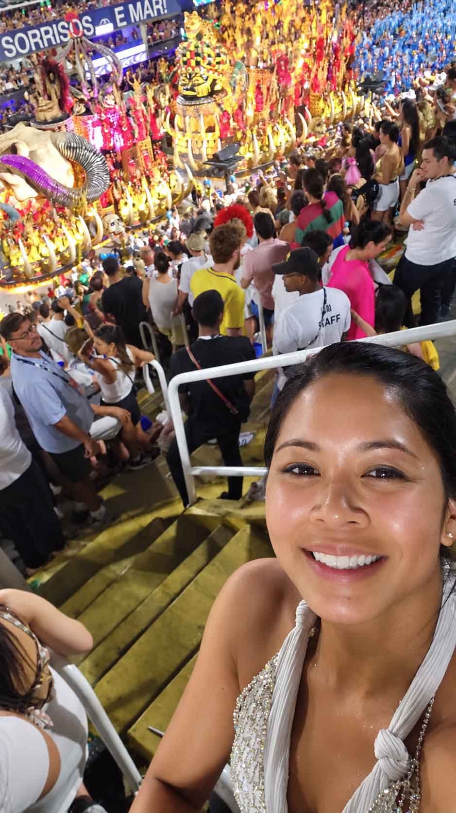 Marie watching the Carnival parade from the stands at Rio's Sambadrome
