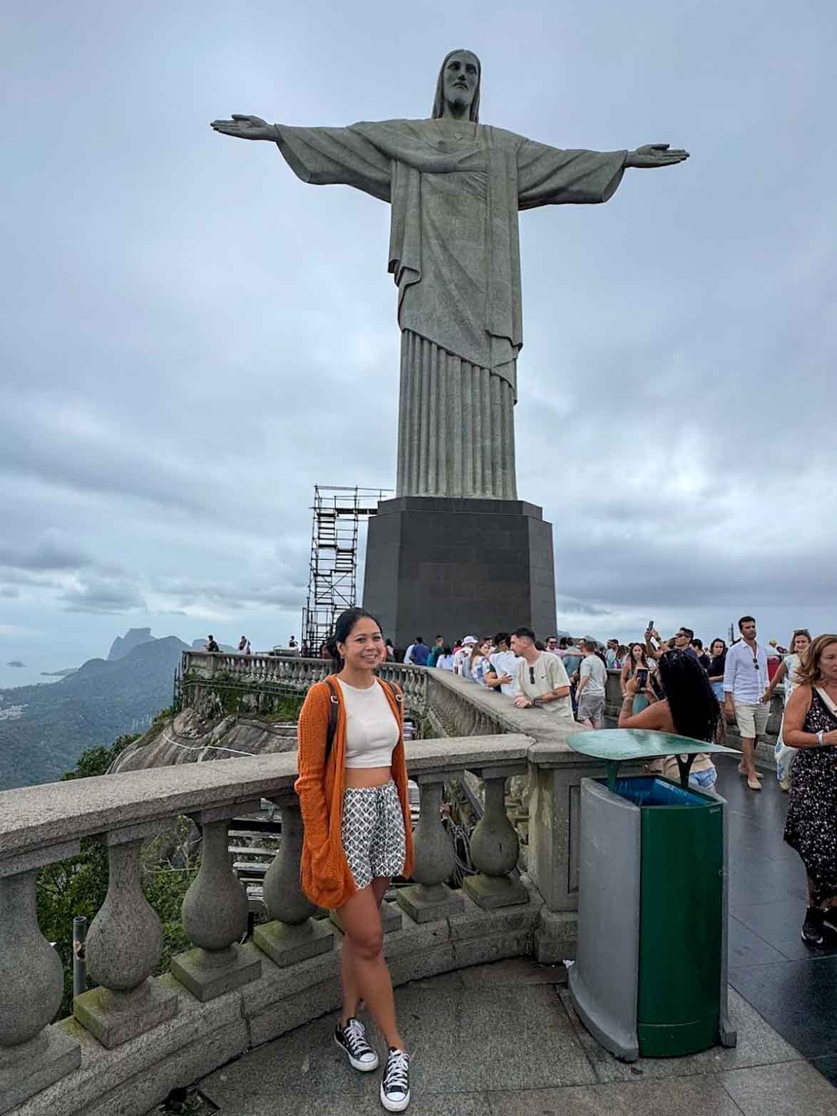 Marie standing beneath Christ the Redeemer in Rio de Janeiro